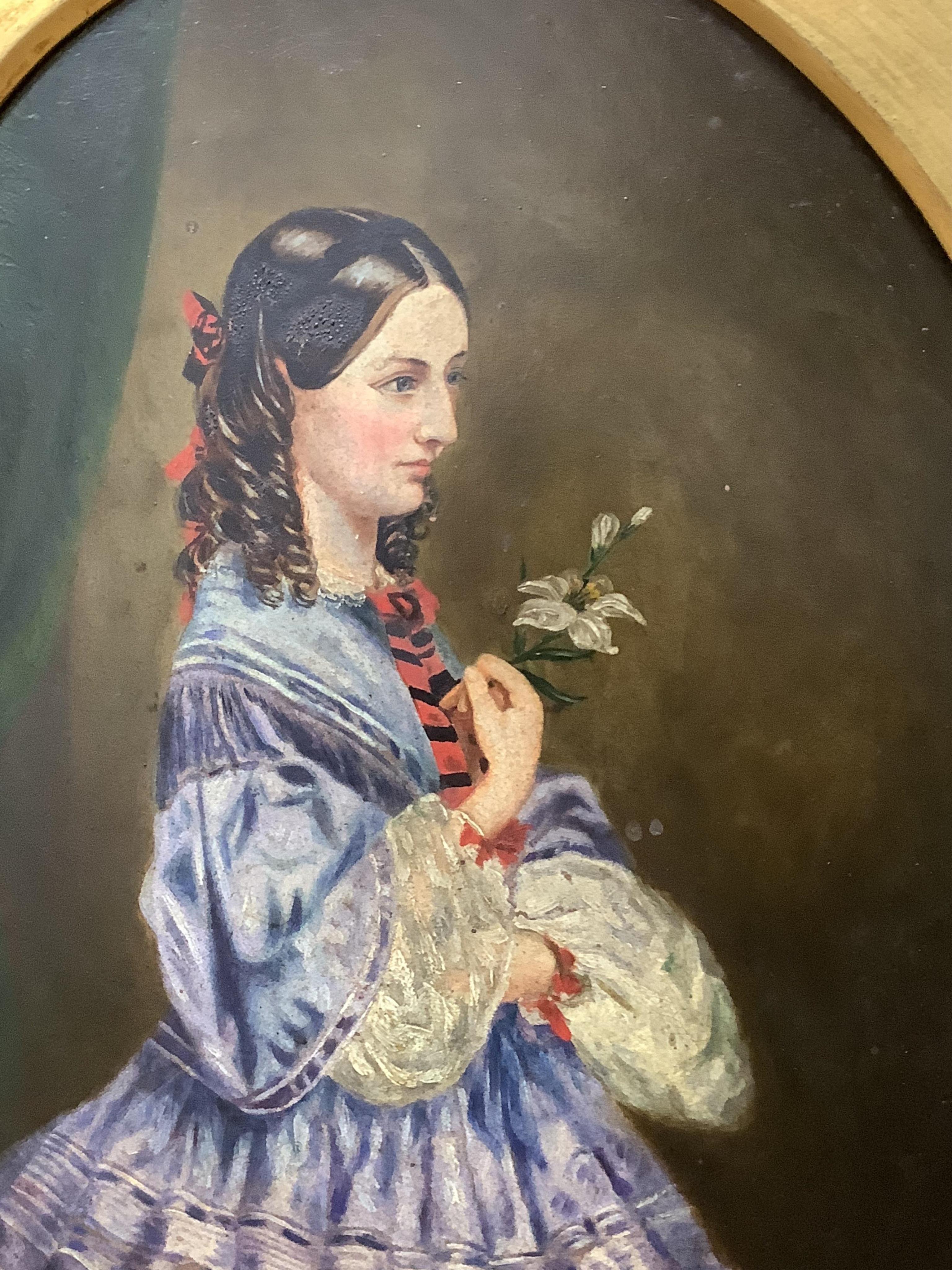 19th century, Naïve school, oval oil on board, three quarter length portrait of a lady, gilt framed, together with a similar portrait of a girl wearing garnet earrings, largest 34 x 24cm